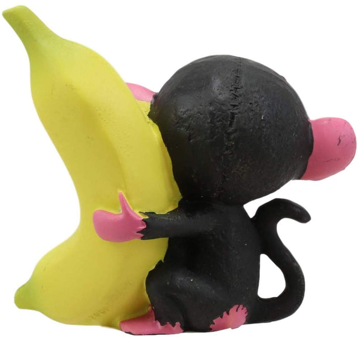 Ebros Furry Bones Pink Baby Monkey With Giant Yellow Banana Figurine 3" Tall