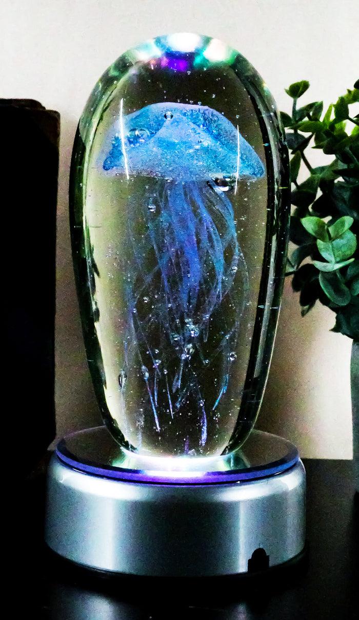 Ebros Glow In The Dark Light Blue Jellyfish 6"H Glass Egg With Color LED Base