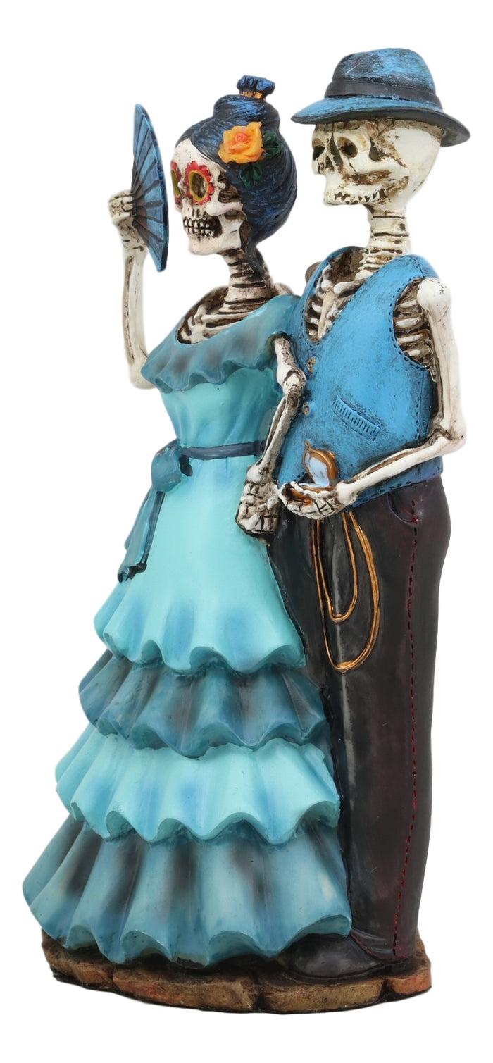 Ebros Love Never Dies Wedding Bride With Fan And Groom Skeleton Couple In Blue Outfits Figurine 7" Tall Day Of The Dead DOD Skulls Ossuary Macabre Graveyard Spooky Halloween Decor Statue