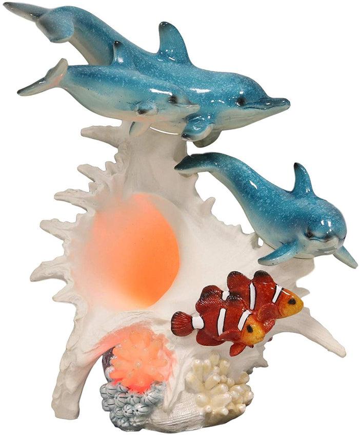 Ebros Nautical Ocean Family 3 Dolphins Swimming Over Giant Sea Conch Clownfishes And Anemones Statue With Colorful LED Light 9.5" Tall