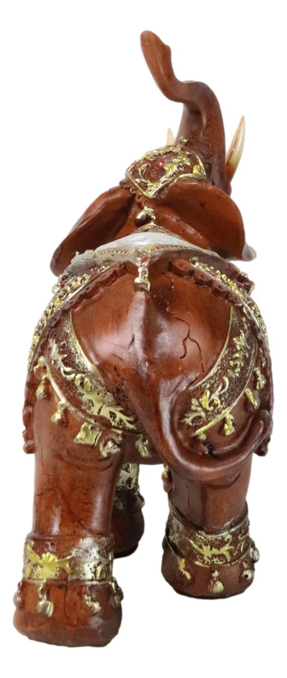 Faux Wood Trunk Up Elephant With Golden Scrollwork And Crushed Glass Figurine
