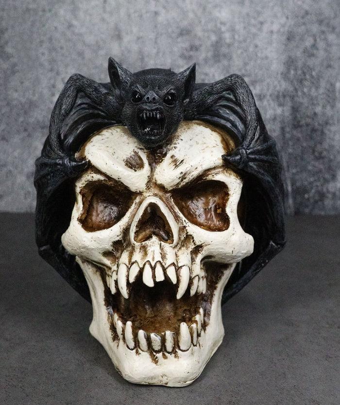 Gothic Nocturnal Vampire Bat Perching On Dracula Fanged Skull Figurine Gothic Nocturnal Vampire Bat Perching On Dracula Fanged Skull Figurine