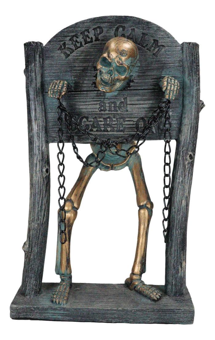 Grinning Skeleton Prisoner Chained At Pillory Keep Calm Scare On Sign Figurine