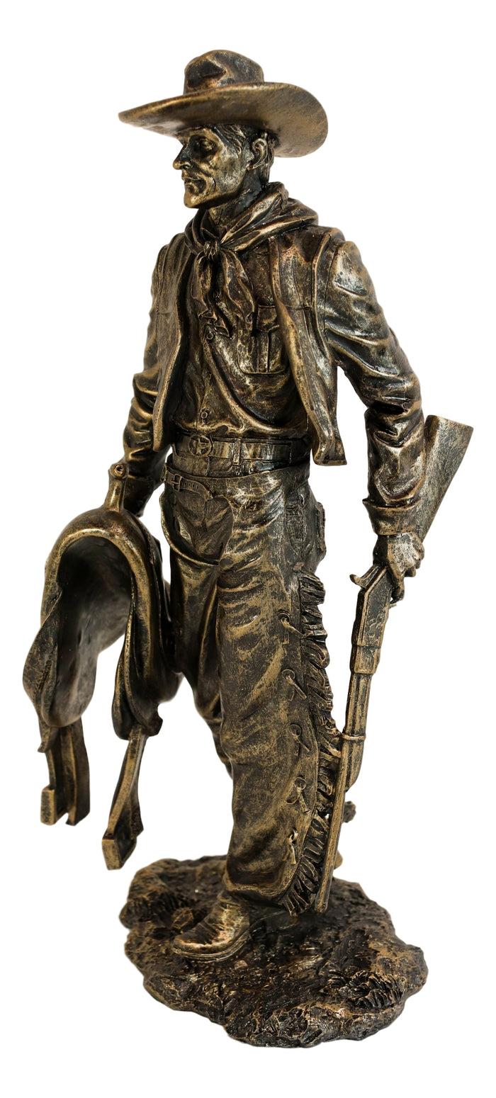 Old World Rustic Western Cowboy Holding Horse Saddle And Rifle Gun Statue 12"H