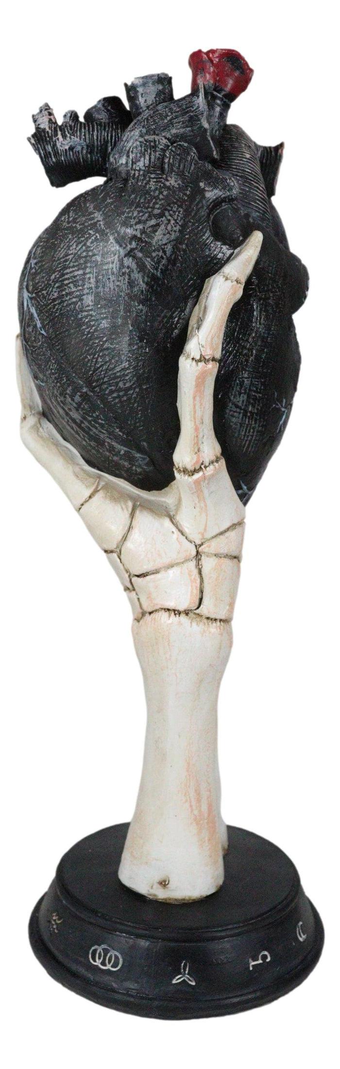 Gothic Alchemy Skeleton Hand Holding Black Anatomy Heart With Evil Eye Figurine